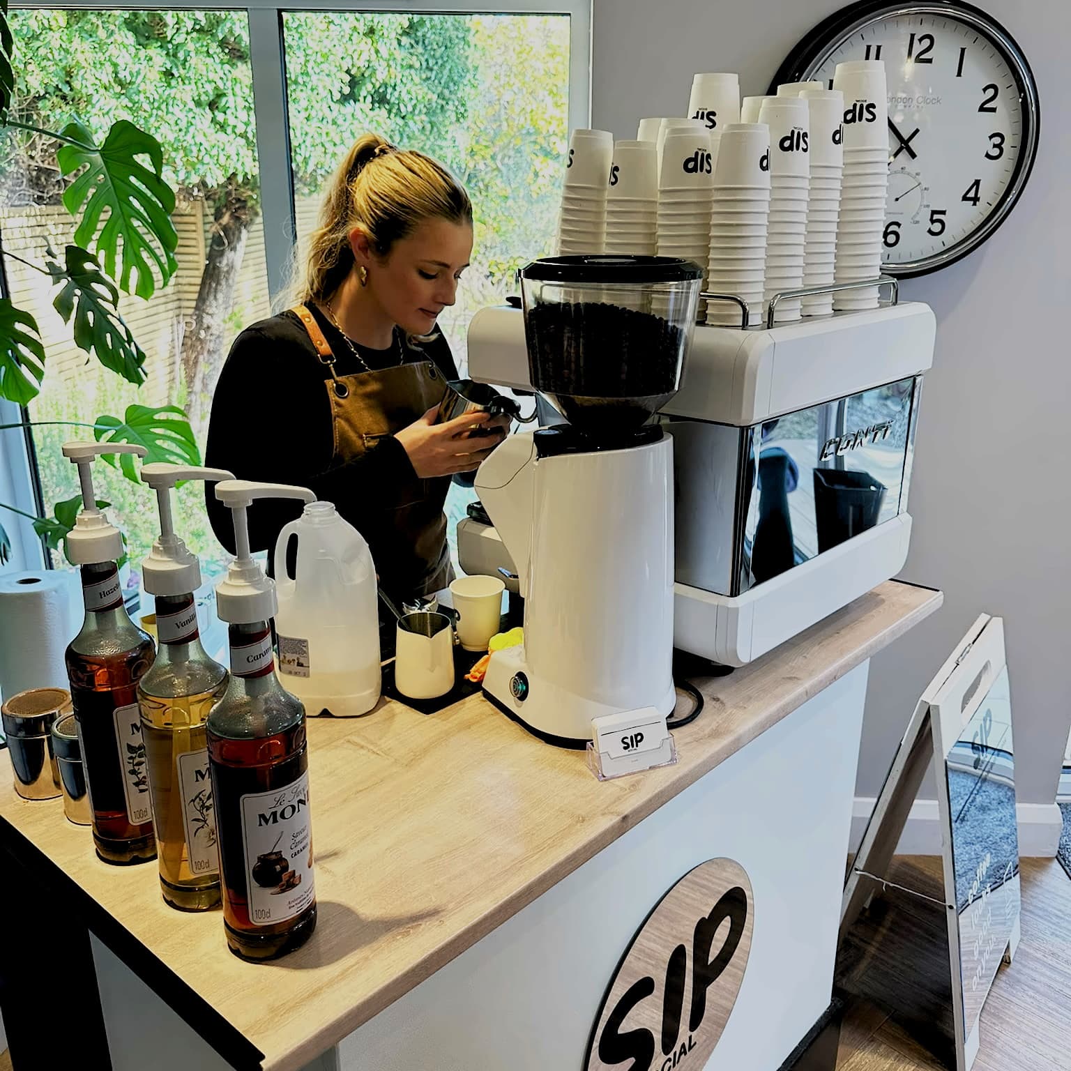 Coffee being prepared on the Sip Social cart during a pop-up