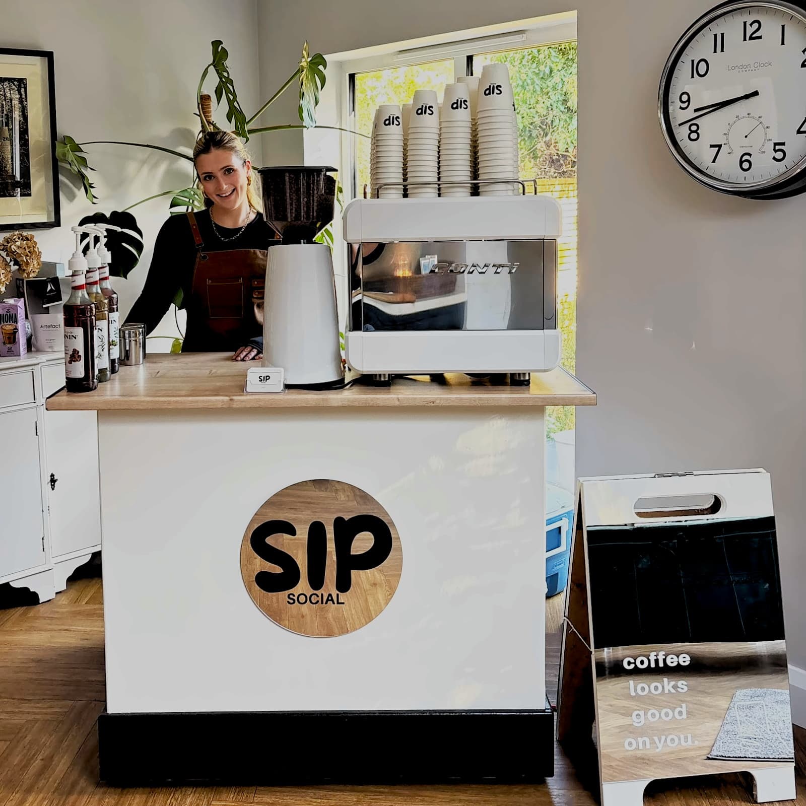Sunlight falling across the Sip Social coffee cart during an event