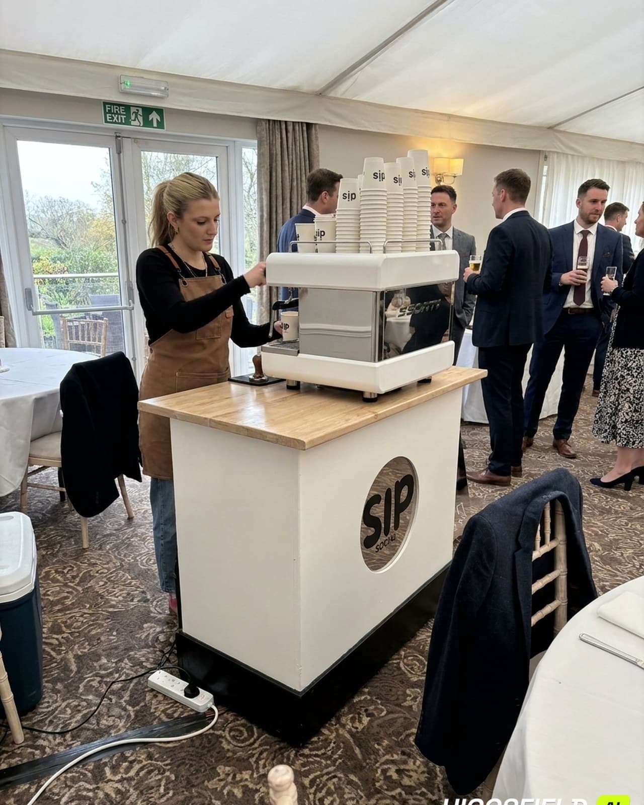 Sip Social coffee cart serving guests at a wedding reception